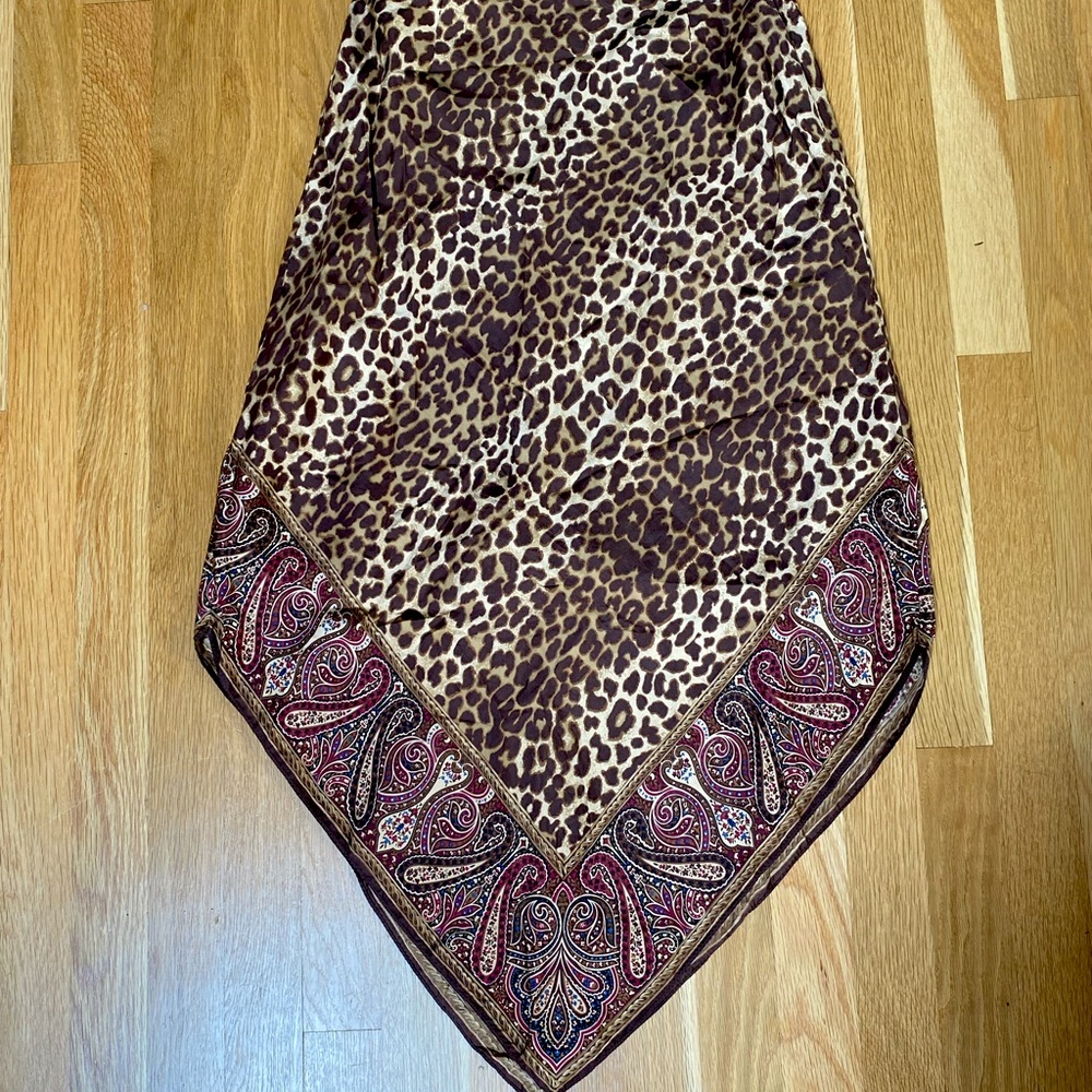 100% silk midi skirt. super flattering triangular cut. zipper in the back.